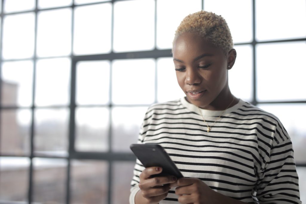 Woman virtual home buying on phone