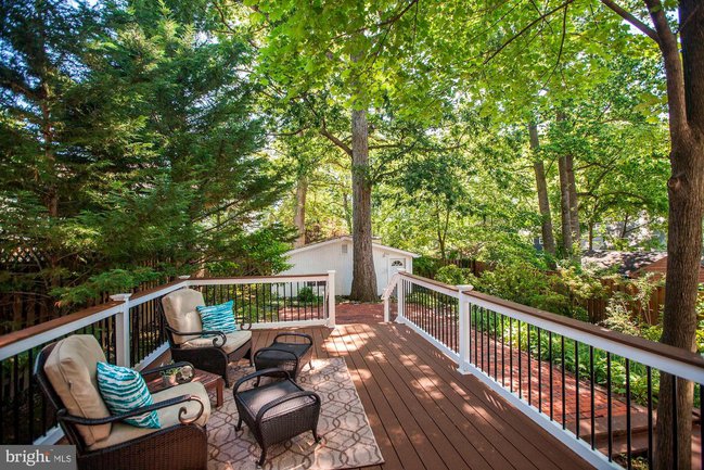 a deck surrounded by trees