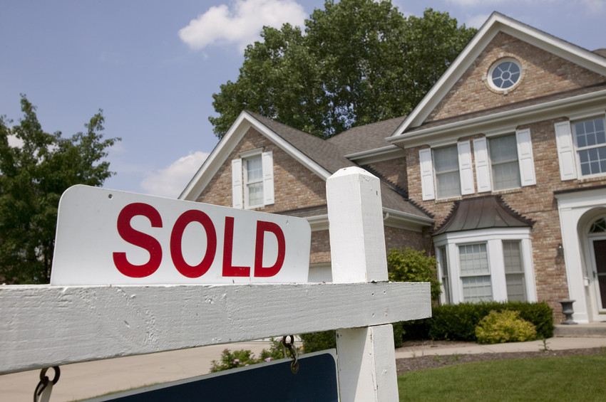 a sold sign on a home