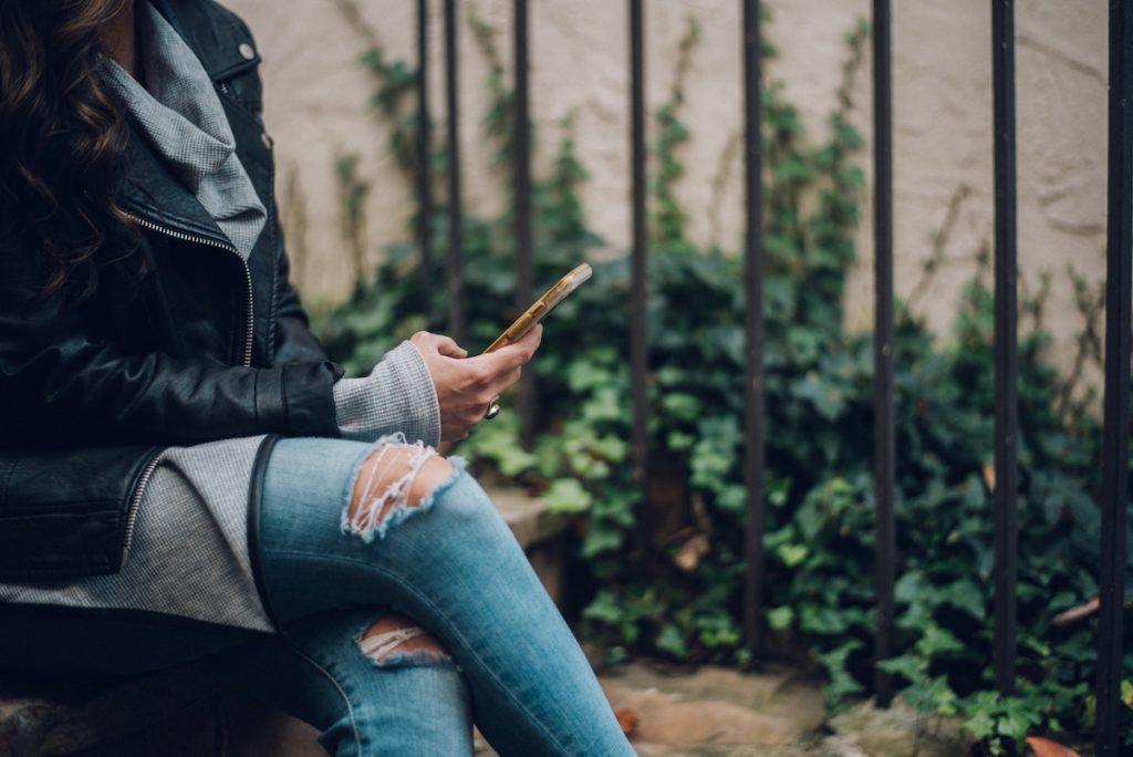 Woman using a phone during fall