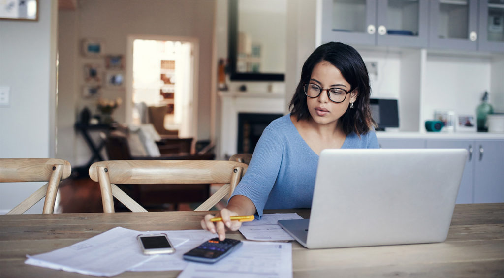 a woman calculating her mortgage interest rates